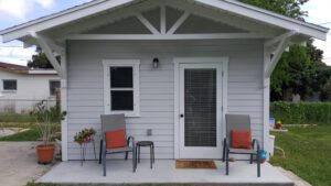 A drawing of an outside building with a porch.